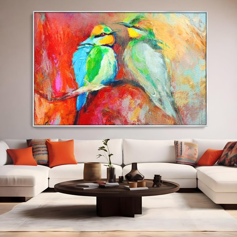 Tablou canvas cu tablou canvas cu doua pasari colorate pe creanga, in rama de aluminiu argintiu, pe perete intr-un living